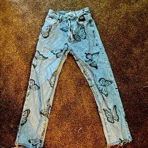 Blue baggy butterfly jeans perfect to wear out in public.